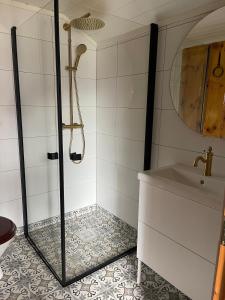 a bathroom with a shower and a sink at Cabin in Oppstryn in Stryn