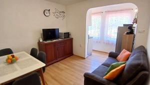a living room with a couch and a table at Summer Dream in Rovinj