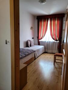 Postel nebo postele na pokoji v ubytování Garni B&B Mozart Nesthouse