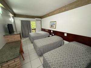 Cama ou camas em um quarto em diRoma Thermas direto com o Grupo diRoma com acesso ao Acqua Park e Café da manhã