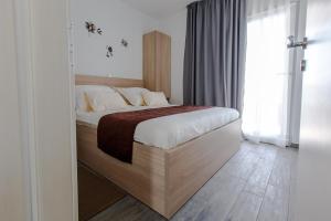 Postel nebo postele na pokoji v ubytování Ra