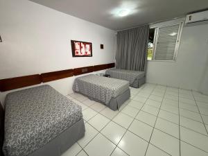 Cama ou camas em um quarto em diRoma Thermas direto com o Grupo diRoma com acesso ao Acqua Park e Café da manhã