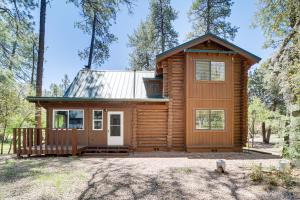 a log cabin in the woods with a porch at Covered Deck, Private Acreage: Log Cabin in Pine in Pine