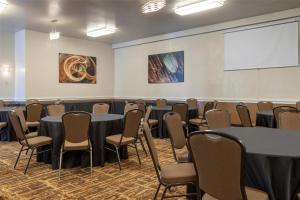 a conference room with tables and chairs and a whiteboard at Best Western Heritage Inn in Concord +30 photos