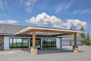 a gas station with awning in a parking lot at Best Western Caribou Inn in Caribou