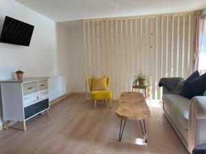 a living room with a couch and a table at Binter Haus -Rattendorf in Rattendorf