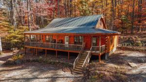a log cabin in the middle of the woods at Saluda Summit Cabin at Cabin Fever in Saluda