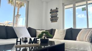 Et opholdsområde på Playa, terraza y parking LUXE + 32 billeder