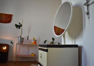 a room with a mirror and a small refrigerator at vintage house - LGBTQ & female friendly in Vienna +90 photos