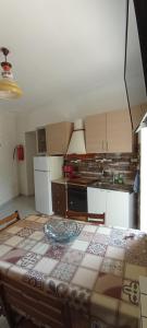 a kitchen with a large table in a room at Casa FLAVIANO in Pizzo