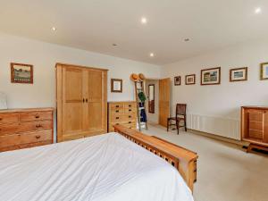 a large bedroom with a bed and a dresser at 1 Bed in Cockermouth 93147 in Cockermouth