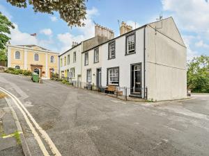 an empty street in front of a white building at 1 Bed in Cockermouth 93147 in Cockermouth