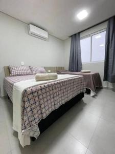 Postel nebo postele na pokoji v ubytování R3- Apto Cataratas - Central