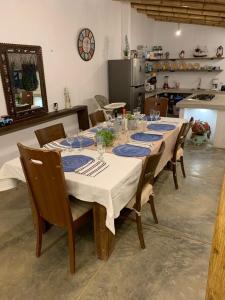 a long table with blue and white plates on it at Casa Montemar in Caleta Grau