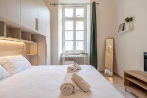 Letto o letti in una camera di Charm in Piazza Castello