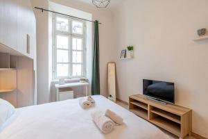 Letto o letti in una camera di Charm in Piazza Castello