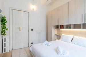 Letto o letti in una camera di Charm in Piazza Castello