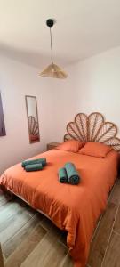 a bedroom with a bed with two towels on it at Canet Plage - Maison 3 chambres in Canet-en-Roussillon