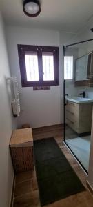 a bathroom with a shower and a sink and a mirror at Canet Plage - Maison 3 chambres in Canet-en-Roussillon +8 photos