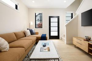 a living room with a couch and a table at Hamilton Place Bayside Building 301 B in Traverse City