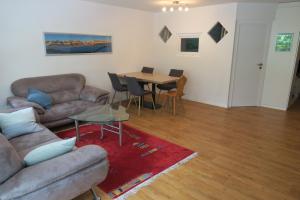 a living room with a couch and a table at Ferienwohnung in den Flumserbergen in Flumserberg
