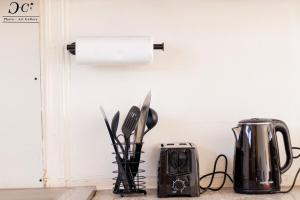 a kitchen counter with a toaster and a toaster at ZM Rooted Properties in Frankfort