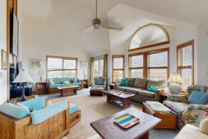 a living room with a couch and a table at Sandy Cay 246 in Salvo