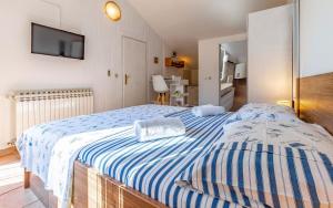 Postel nebo postele na pokoji v ubytování Apartment Eva