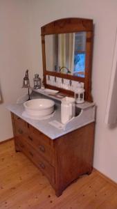 a bathroom vanity with a sink and a mirror at Ferienwohnung Melba in Traben-Trarbach