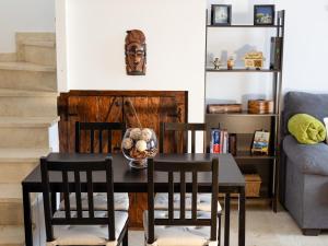a dining room with a table and two chairs at Casa Triana in Costa Teguise