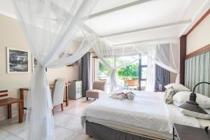 Ένα ή περισσότερα κρεβάτια σε δωμάτιο στο Hotel Aguia Negra