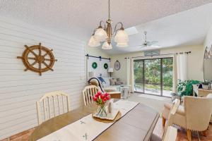 a dining room and living room with a table and chairs at After Dune Delight in New Smyrna Beach