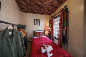 Postel nebo postele na pokoji v ubytování Riad Africa