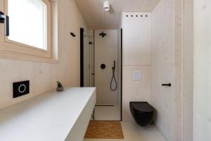 a bathroom with a sink and a toilet and a shower at Villa Nautilus Buqez Resort in Drage +7 photos