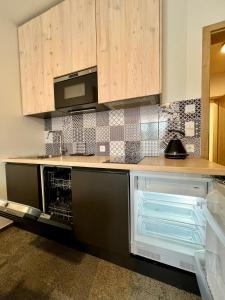 Kuchyňa alebo kuchynka v ubytovaní Apartmány na sjezdovce Dolní Morava