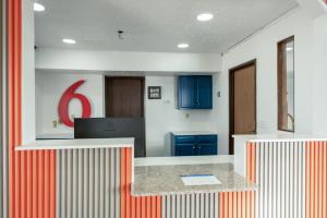 a kitchen with blue cabinets and a red number at Studio 6 Limon, CO I 70 in Limon