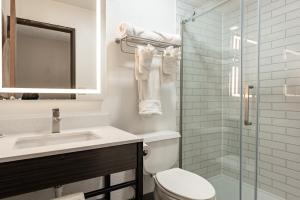 a bathroom with a toilet and a sink and a shower at Studio 6 Limon, CO I 70 in Limon