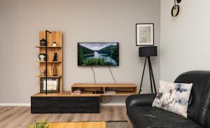 a living room with a couch and a coffee table at Industrial Home Vršac in Vršac