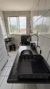 a kitchen with a sink and a sink at Apartamento no Athenas Park V 2o Andar in São Luís