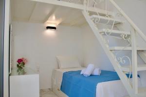 a bedroom with a bunk bed with a ladder at Central Luxurious Retreat in Argostoli +44 photos