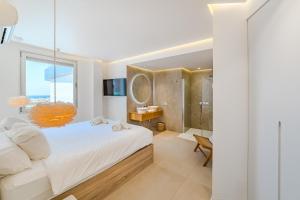 a bedroom with a large bed and a shower at OCEAN GARDEN Sunset & Sunrise - heated pool - AC - lounge zone in Adeje