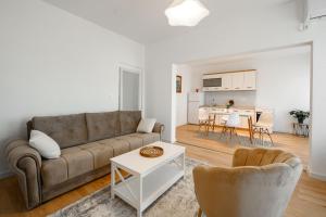 a living room with a couch and a table at Harmony Point in Bar
