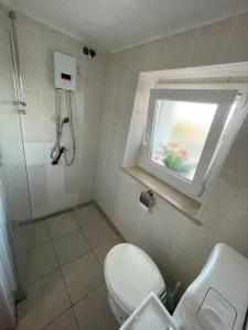 Koupelna v ubytování Planinski dom Janče + 37 fotografií