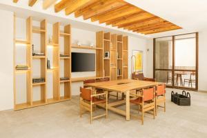 a dining room with a table and chairs at Clevia, San Miguel de Allende, Autograph Collection in San Miguel de Allende