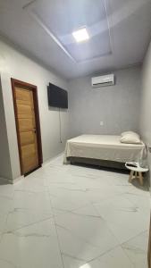 TV a/nebo společenská místnost v ubytování espaço R&H