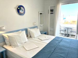 A bed or beds in a room at Vavanos Studios