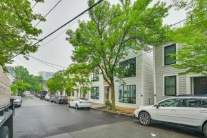 a street with cars parked in front of houses at Near Biotechs and MIT Cozy Condo with Fireplace in Cambridge