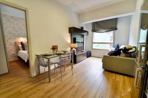 a living room with a couch and a table at The Poet´s Corner Holiday Home in Triana