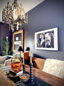 a living room with a table with a chandelier at Cozy 4-Bedroom Apartment in Evanston in Evanston