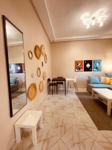 a living room with a couch and a table at Relax Family 05 in Ouarzazate
